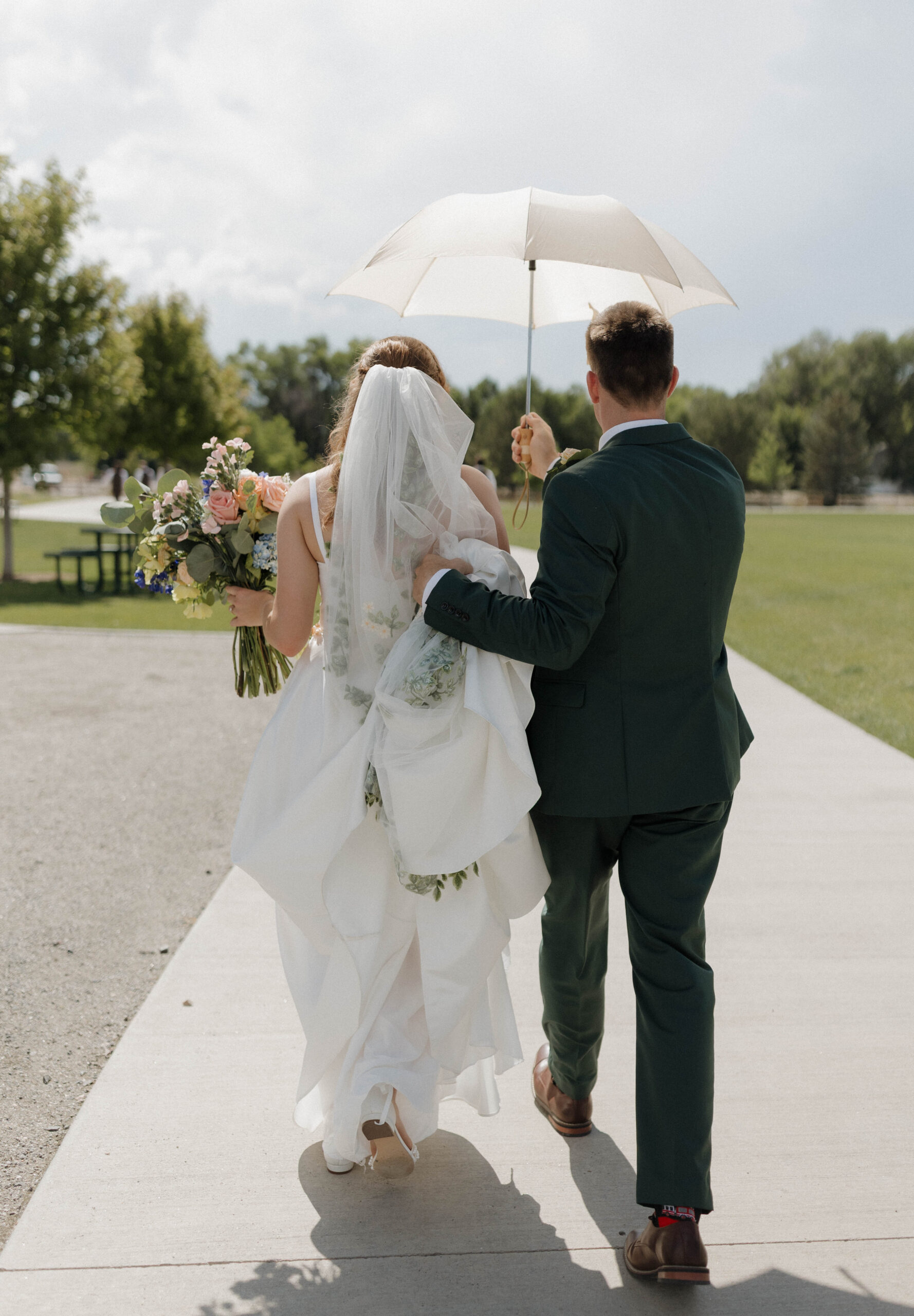 Editorial bride holding a grand organic English garden rose bouquet